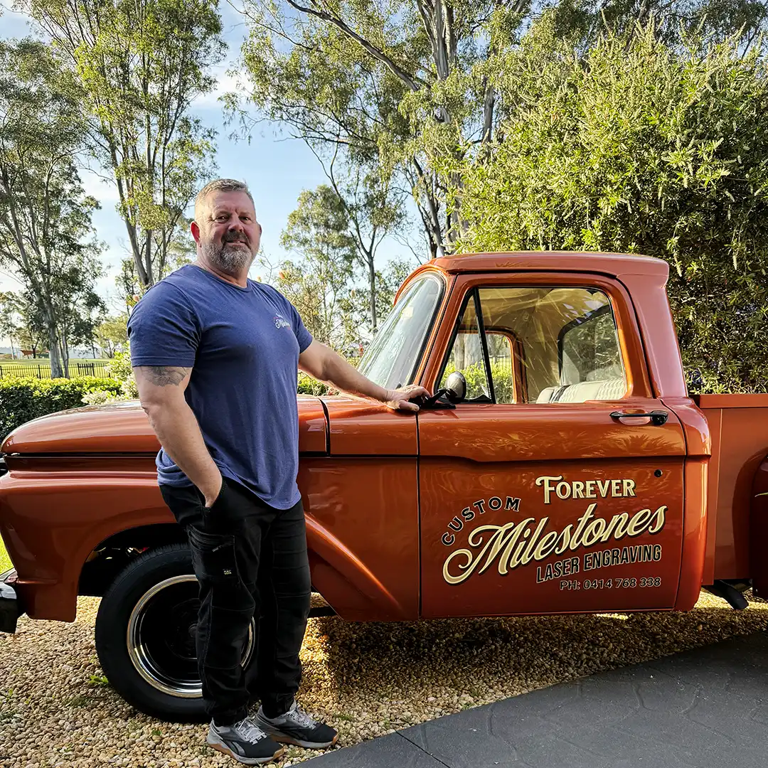 Phil Taylor beside the Forever Milestones custom truck