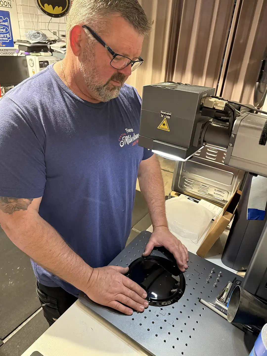 Phil Taylor working at engraving equipment in the Jamisontown workshop