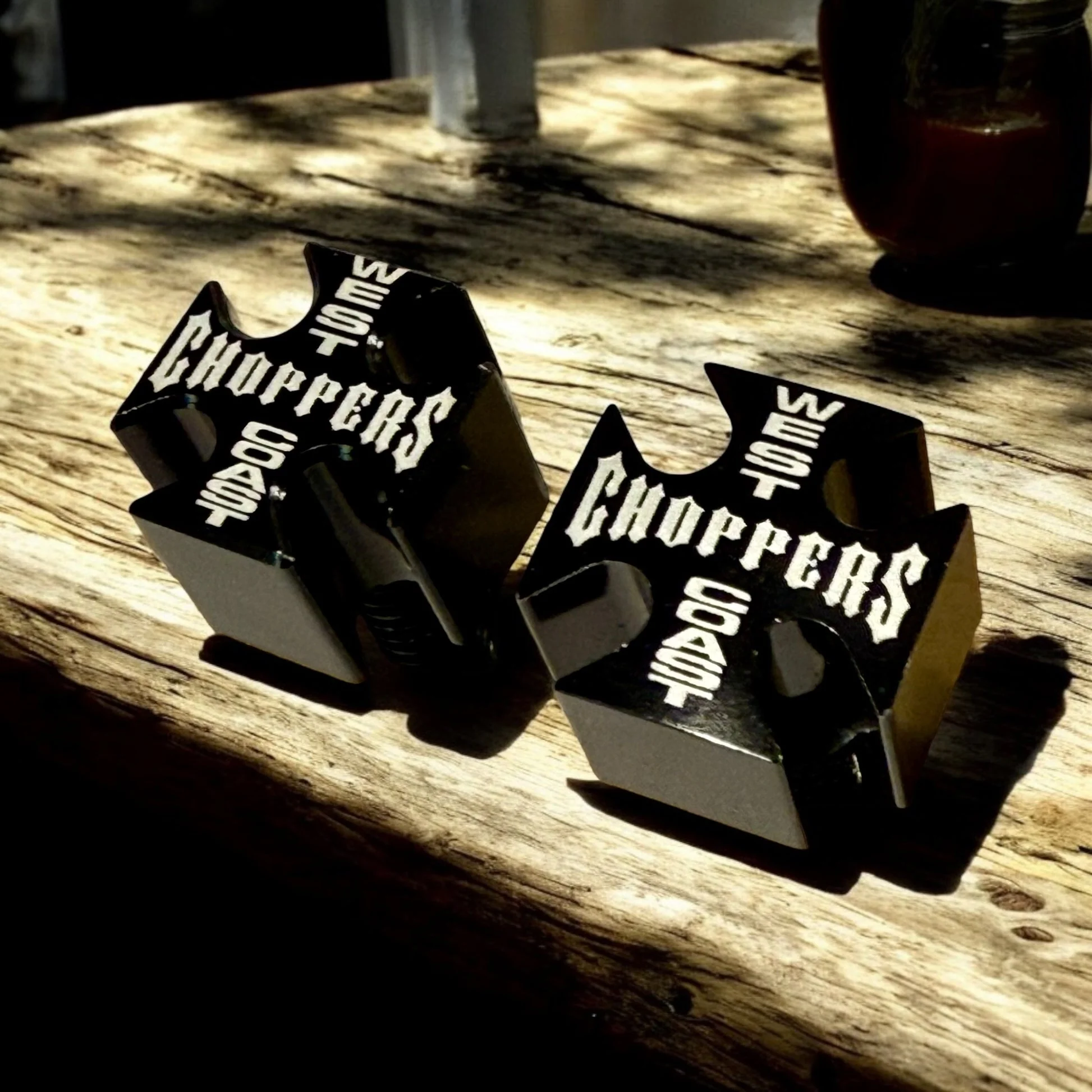 Pair of black custom motorcycle seat bolts engraved with Choppers lettering