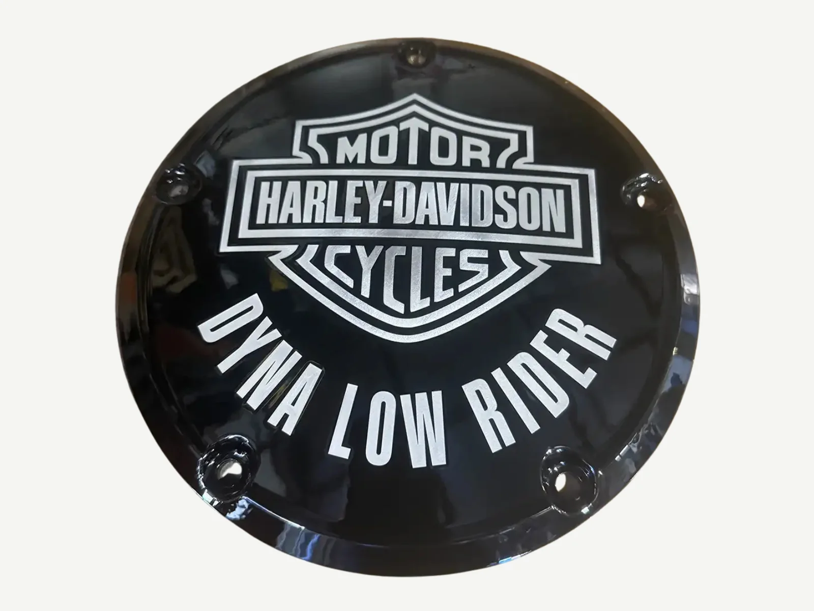 Black Harley-Davidson derby cover engraved with the words Dyna Low Rider