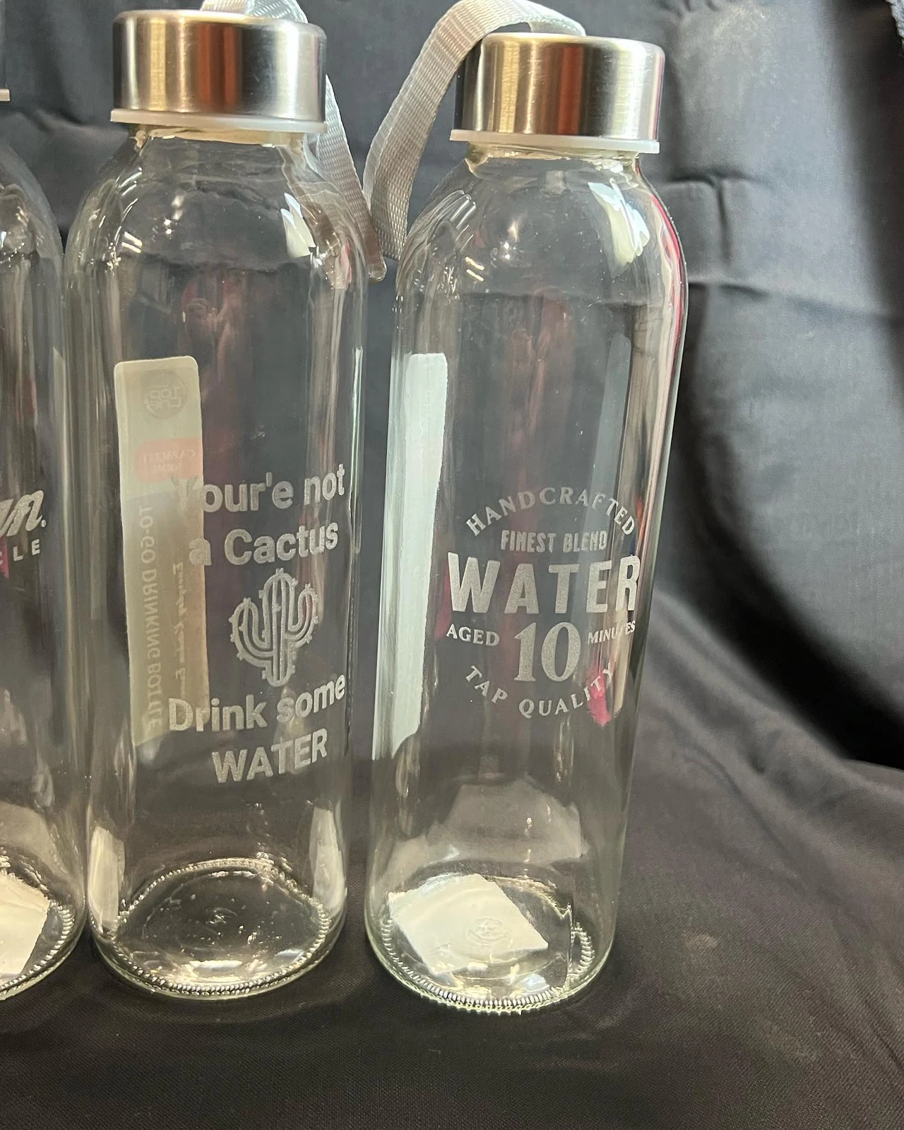Clear drink bottles engraved with personalised designs