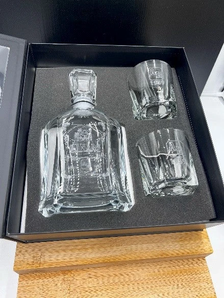 Engraved decanter with two matching glasses presented in a box