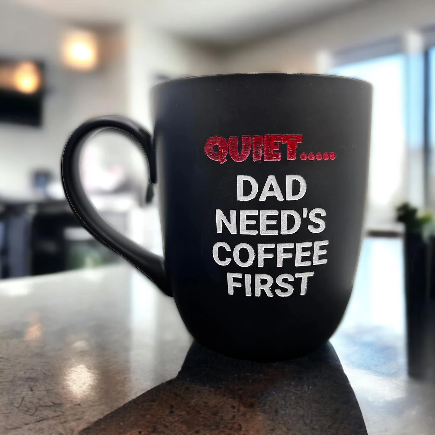 Black coffee mug personalised with red and white lettering