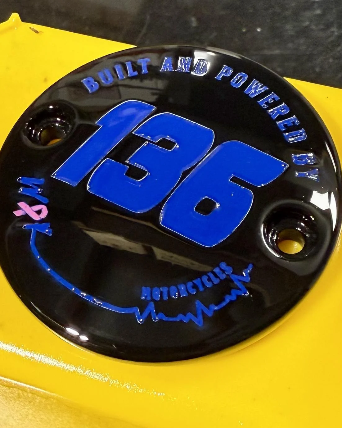 Black M8 timing cover with blue 136 custom lettering