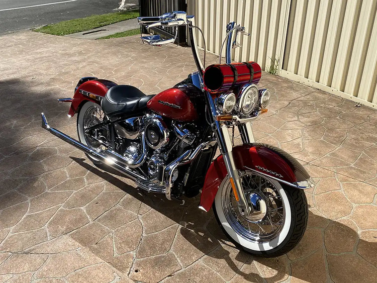 Red custom Harley-Davidson motorcycle photographed outside Phil's workshop
