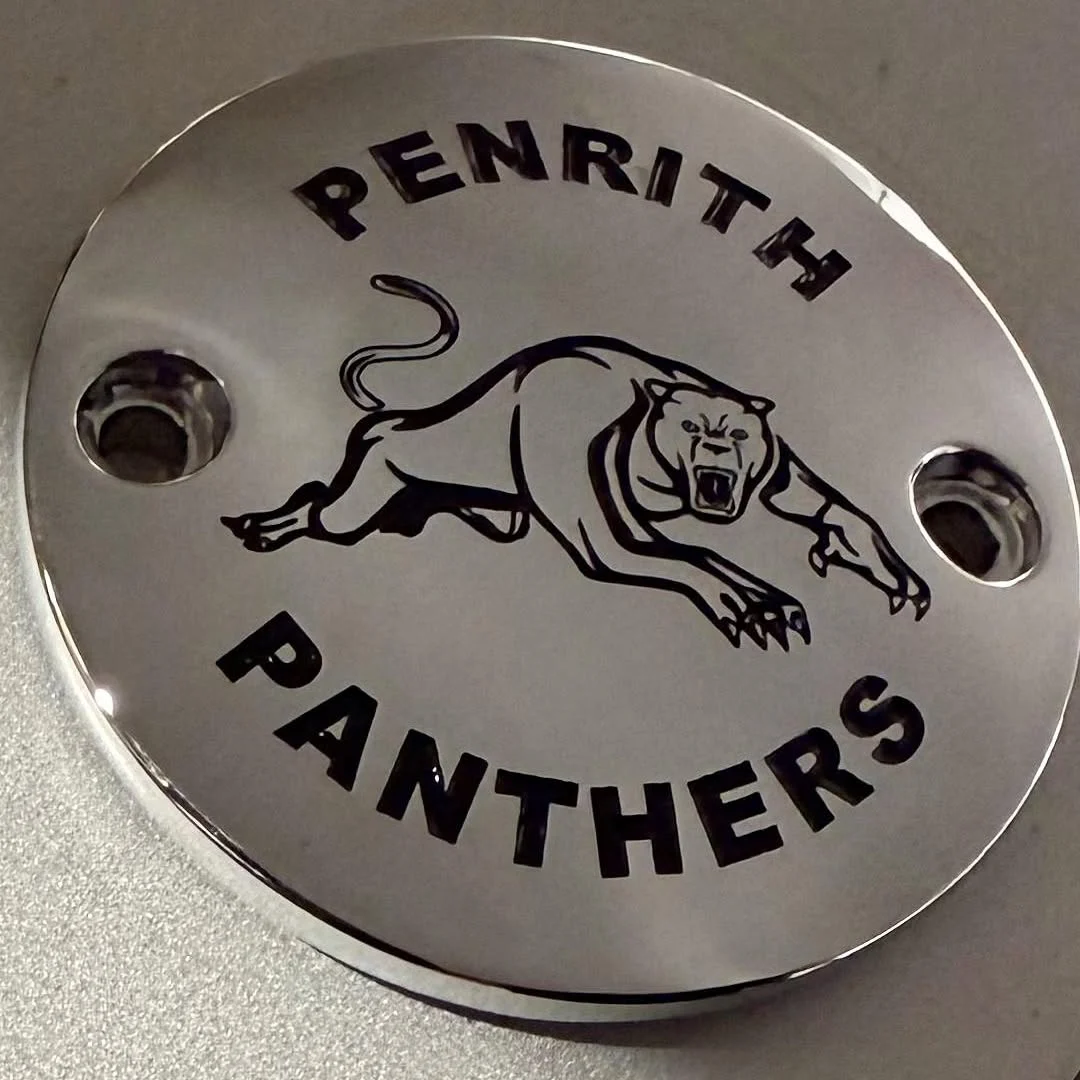 Silver M8 timing cover engraved with a Penrith Panthers themed design