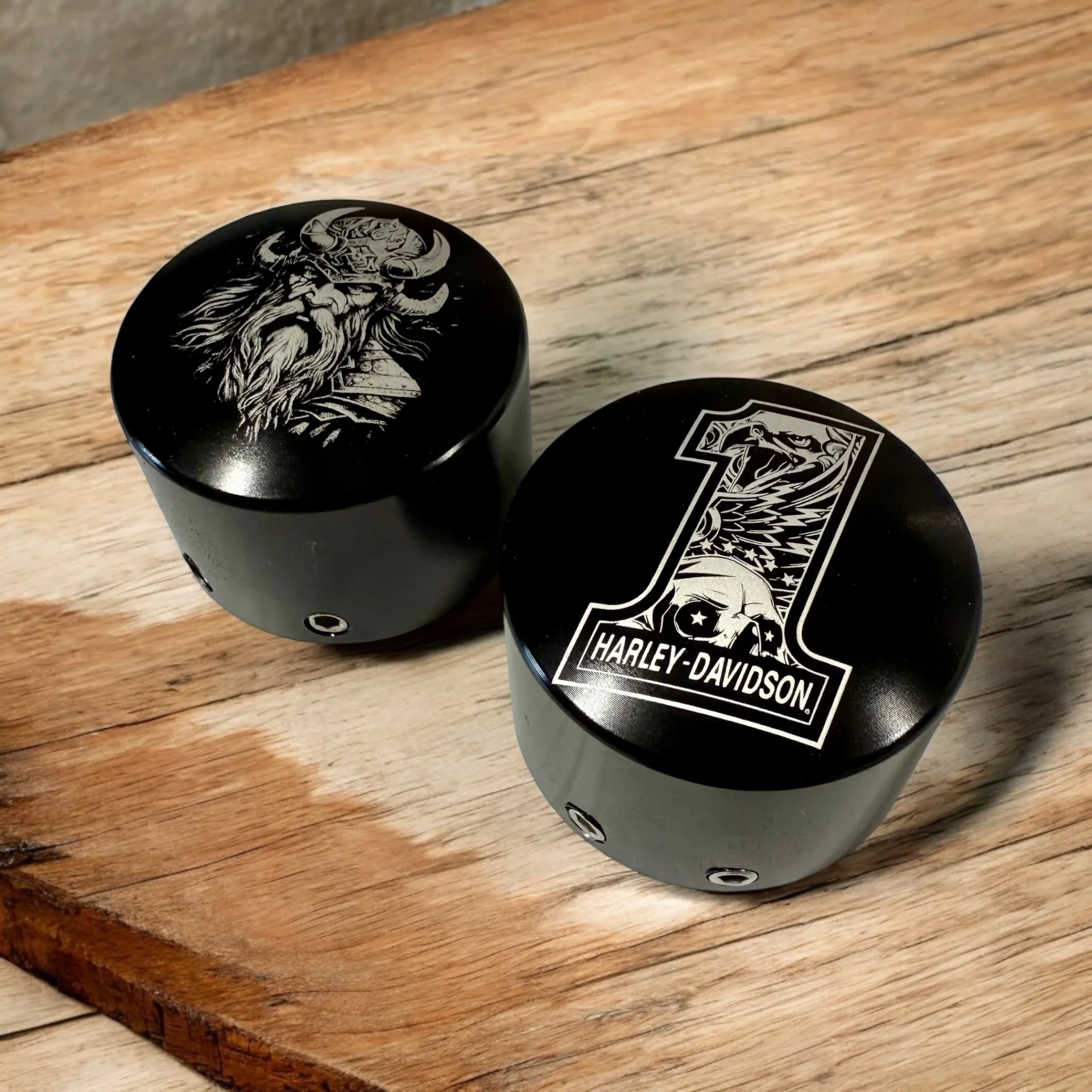Pair of Harley-Davidson front axle nut covers with detailed custom engraving